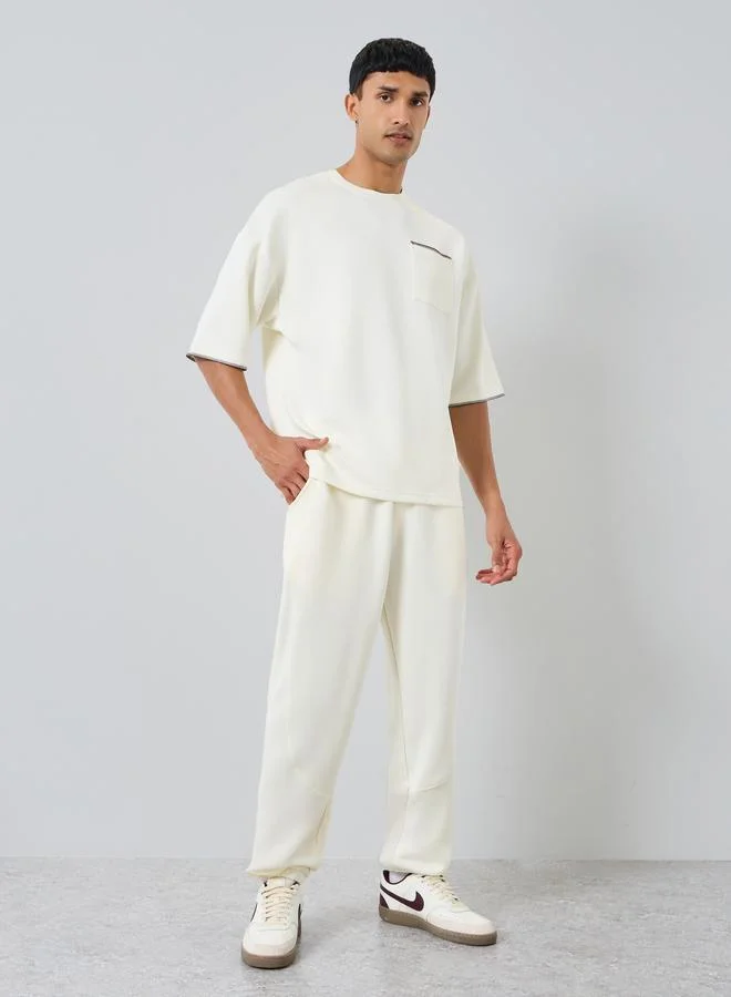 Styli Men Cream Boxy Fit T-Shirt with Contrast Stitching